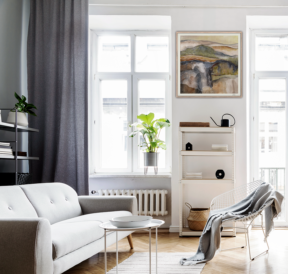 Living room with a work of art hanging above the fireplace